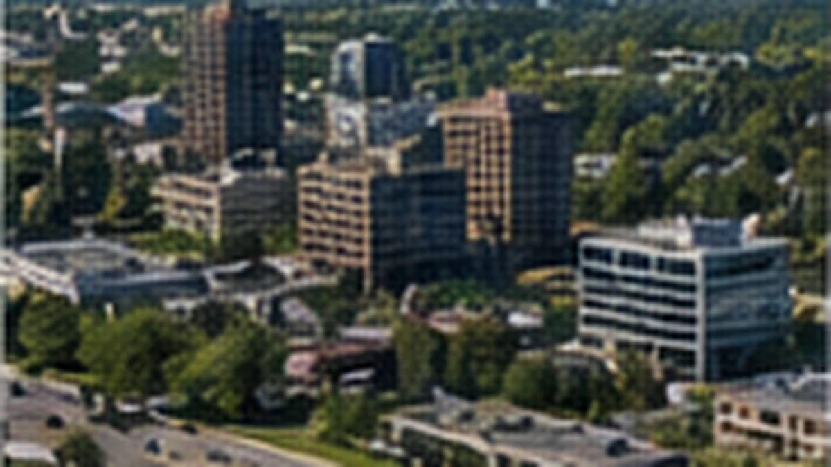 Aerial view of a suburban town centre with mid-rise buildings and trees